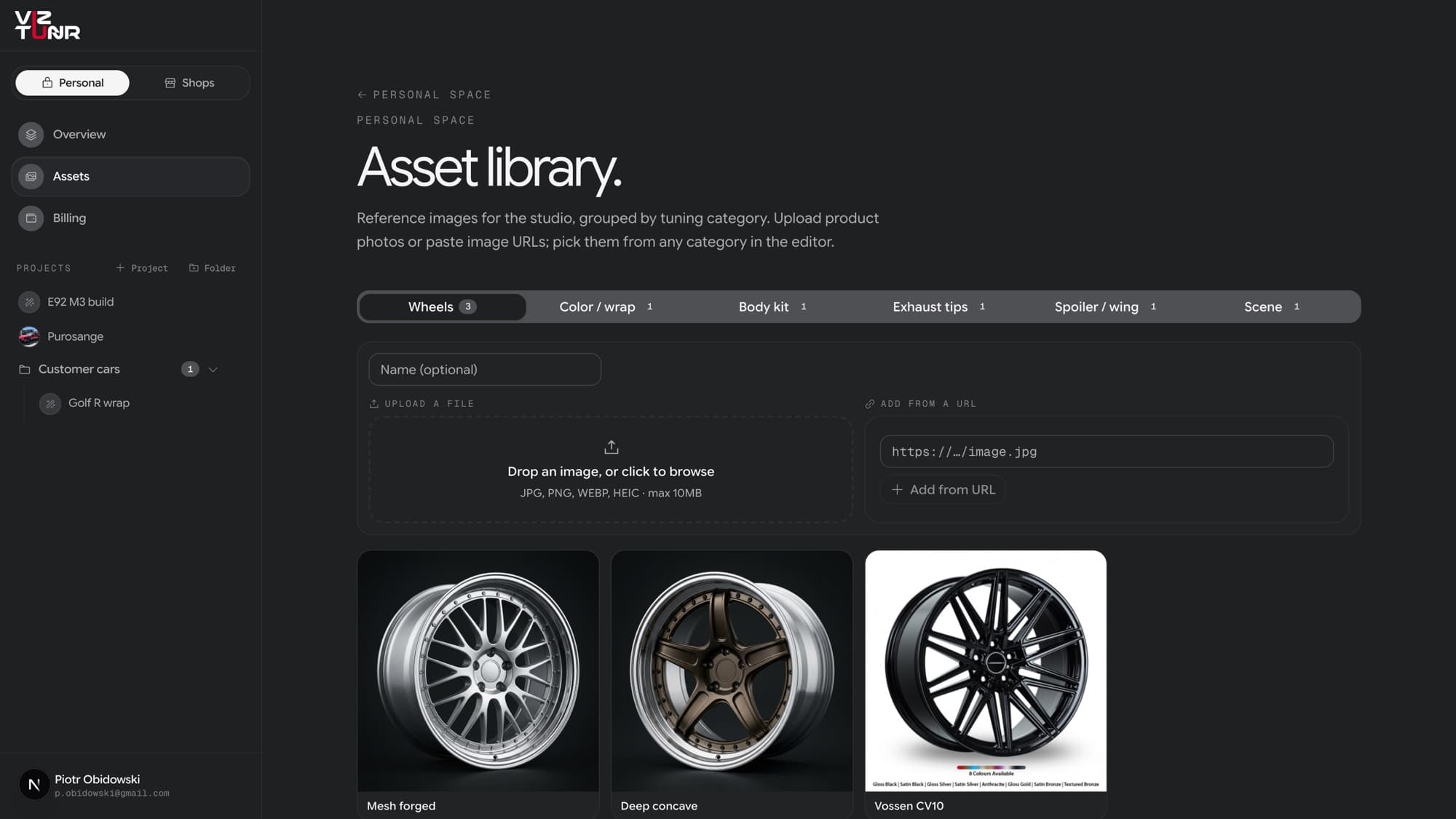 The asset library page with category tabs, a file drop zone next to an add-from-URL field, and saved wheel reference images