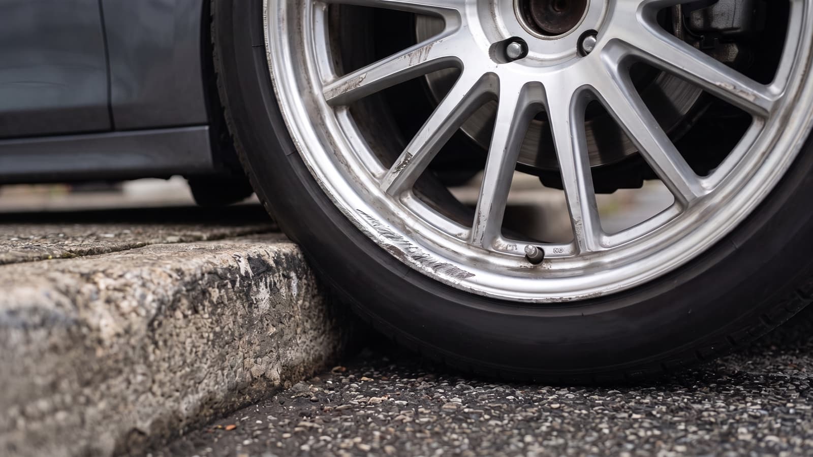 Curb Rash Repair: Cost, DIY & When to Replace