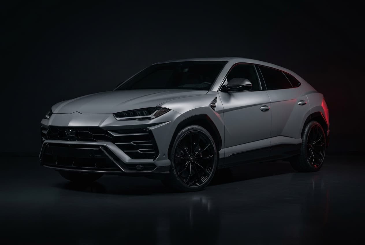 Photoreal render of a 2026 Lamborghini Urus in a satin nardo-grey wrap on gloss-black wheels.